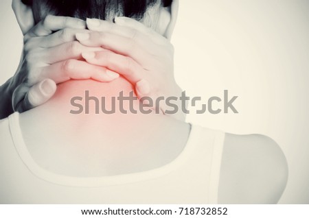 Asian woman with pain in neck., Black and white photo of pain highlighted by red dots. Close-up photo.