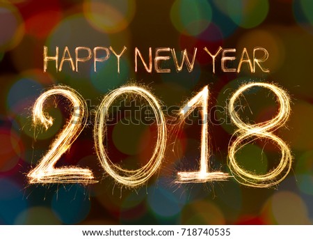 Happy new year 2018 written with Sparkle firework and firework background