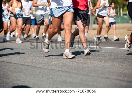 Street race, showing the legs of the runners Royalty-Free Stock Photo #71878066