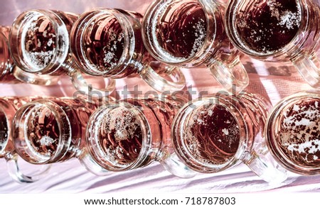 top view to row of dark beer glasses on wooden background football fan set. many glasses mugs with dark and light beer at octoberfest. beer for relax in partytime