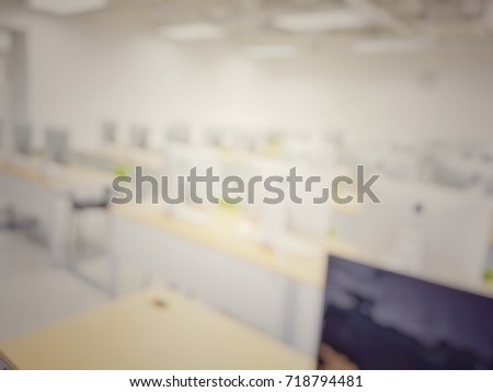 Computer PC lab classroom with rows of monitor in white room school in blur background vintage tone.