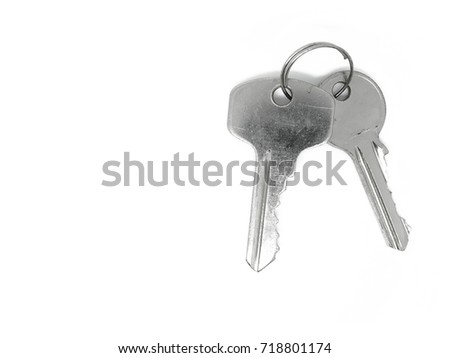 Top view two shiny silver color iron steel keys with ring, on white background isolated, with clipping path