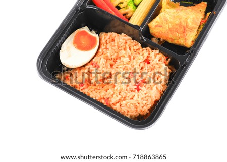 close up fried rice with egg and vegetables in lunch box set  on white background
