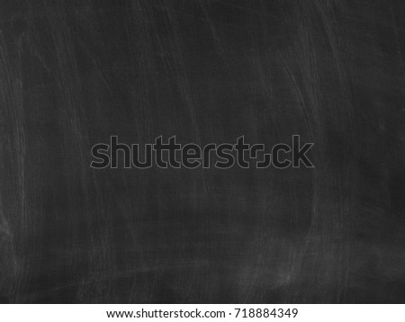 Chalk rubbed out on blackboard for background. texture for add text. Empty blank black chalkboard