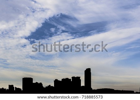 Blue sky with clouds and silhouette city. / Beautiful sky and silhouette city. / Abstract Background.
