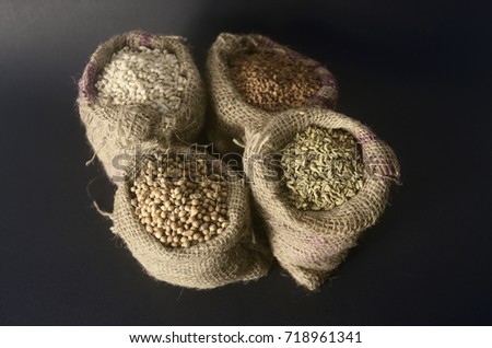 gunny sack fill with spices on dark background