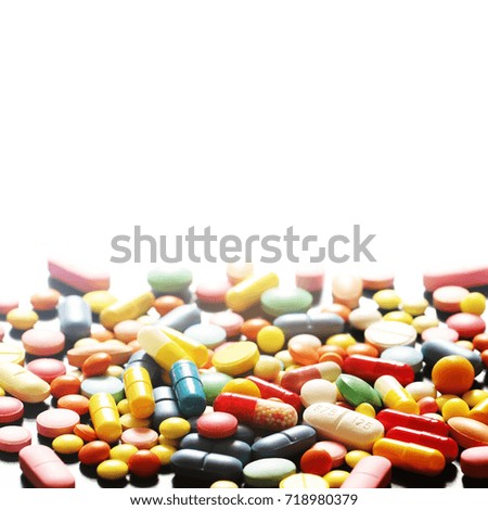 Colorful medicine pills on white