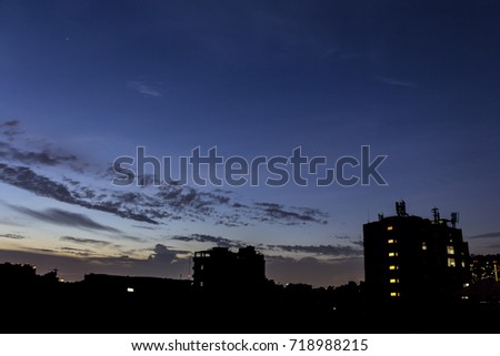 Twilight sky in evening with silhouette city. / Beautiful sky and silhouette city. / Abstract Background.