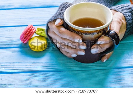 Still life with cup of tea on the wooden background