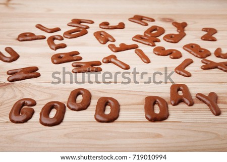 Good Day written by chocolate cookies alphabet