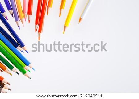Color pencils on white background. Free space for text. Tools for drawing, education, school, creativity.