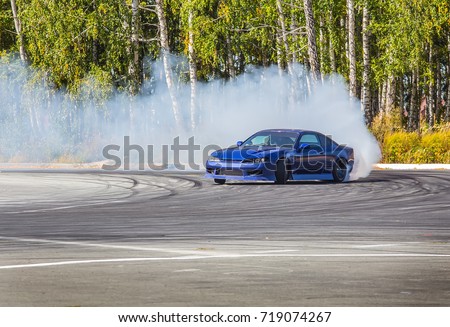 Race car drifting on speed track
