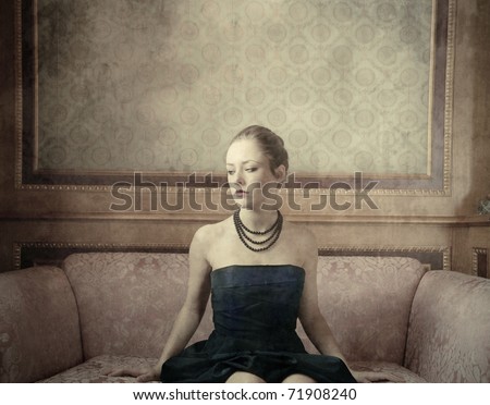 Beautiful woman sitting on a sofa