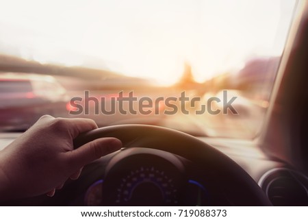 vintage tone image of people driving car on day time for background usage.