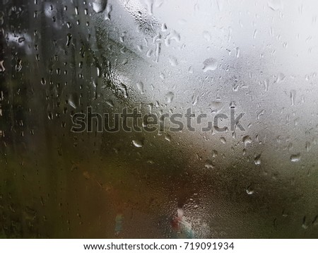 Rain On the glass Background bokeh . of colorful lights for use as illustrations in art and design