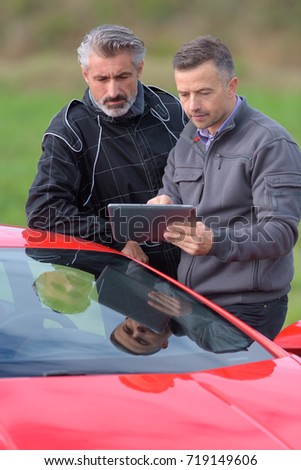 pilot and engineer reviewing performance during speed tests Royalty-Free Stock Photo #719149606
