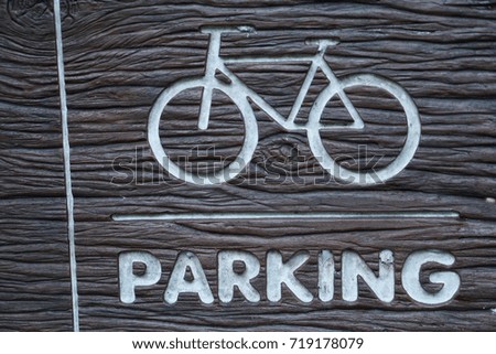 Wooden bicycle parking sign in the national park, cycling along the park. Holidays in Bangkok Thailand 