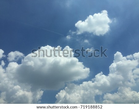 Blue sky with white big clouds. Beautiful day