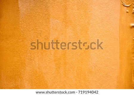 Grunge Orange Paint Concrete Wall Background.