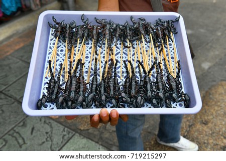 Fried scorpion on the market of Khao San Road on Bangkok, Thailand