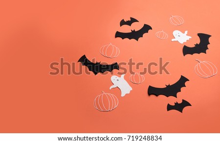Traditional halloween symbols of black bats, pumpkins and ghosts on red background. Halloween picture and frame for logo