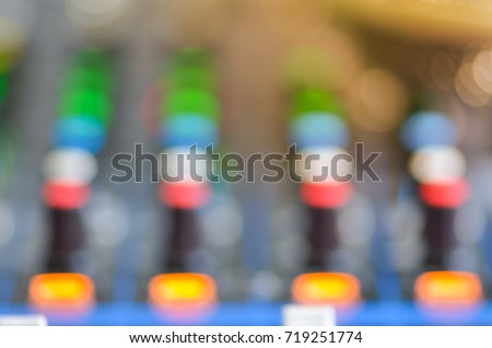 blurry Closeup audio mixer slider in the control room.