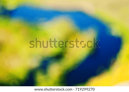 abstract colorful unfocused (blurred) background with river in the valley