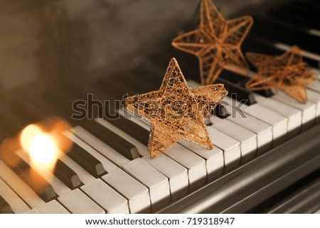 Piano keyboard with Christmas decoration, closeup