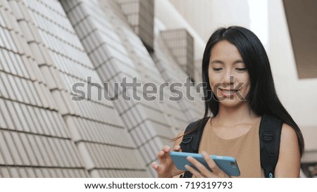 Woman taking photo with cellphone