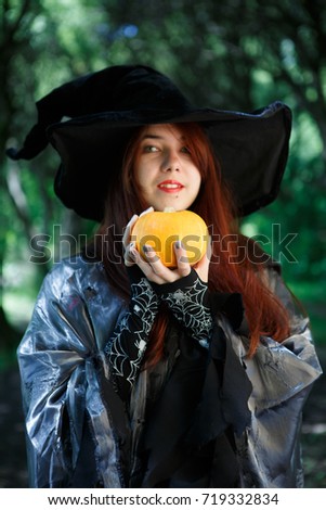 Close-up picture of witch with pumpkin