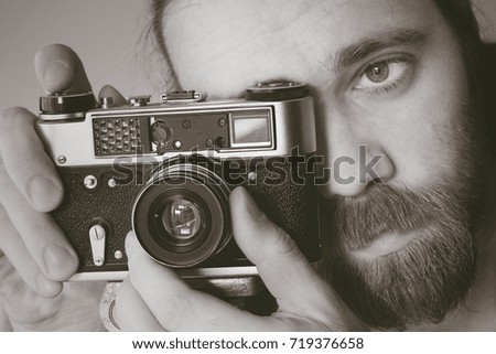 Man with old photo camera