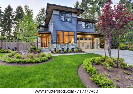 Luxurious new home with curb appeal. Trendy grey two-story mixed siding exterior in Bellevue with well kept front yard. Northwest, USA