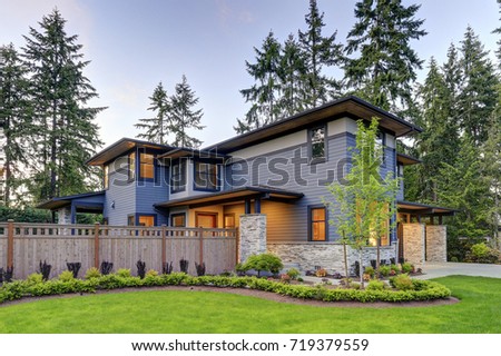 Luxurious new home with curb appeal. Trendy grey two-story mixed siding exterior in Bellevue with well manicured front yard. Northwest, USA