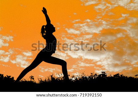 Outdoor woman yoga silhouette.