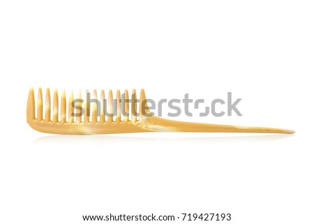 comb plastic color brown isolated on white background.