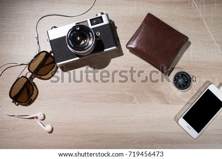 Old retro analog photo camera and accessories travel concept