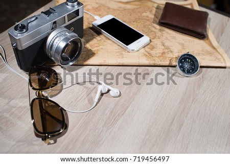 Old retro analog photo camera and accessories travel concept