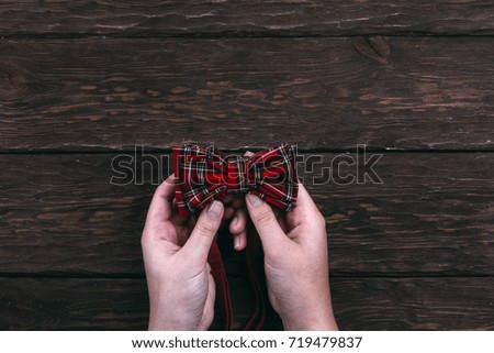 girl holding a tie