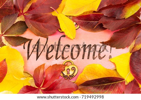 Welcome note and fallen autumn leaves