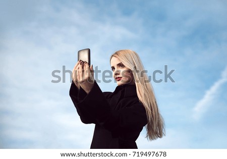 Young woman taking selfie outdoor