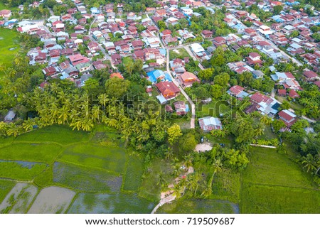 Top view Aerial photo from flying drone over small village in Thailand.