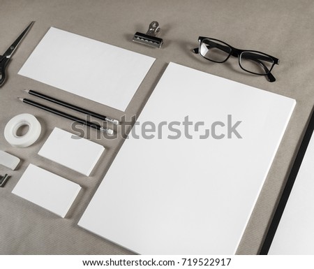Photo of blank stationery and corporate identity template on craft paper background.