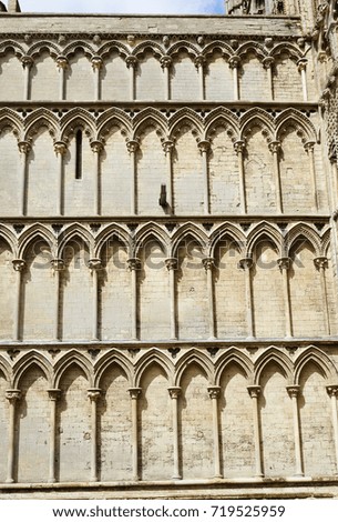 Architectural detail of arches on exterior wall of the Romanesque/Gothic style Ely Cathedral