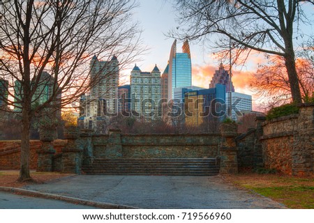 View of stone stairs in the Piedmont Park and Midtown Atlanta behind it in autumn evening, USA
