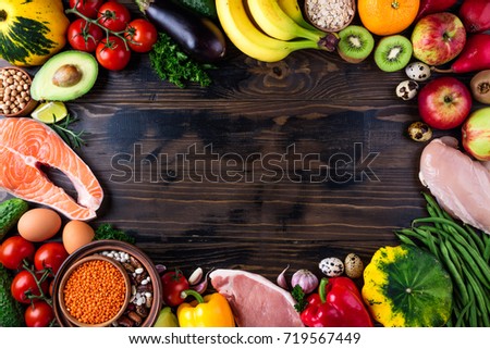 Selection of healthy food. Fresh organic vegetables, fruits, meat and fish. Healthy eating and healthy life concept. Top view, copy space Royalty-Free Stock Photo #719567449