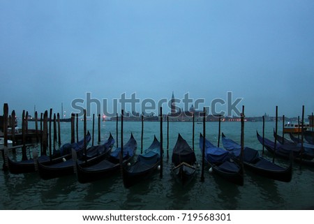 gondolas in rain, venice italy
