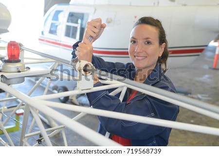 woman fixing plane