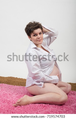 Portrait of a young beautiful pregnant girl