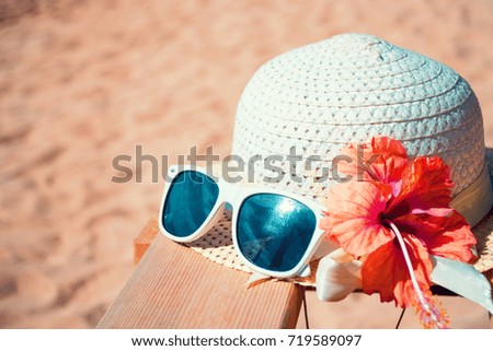Beach accessories on wooden board.