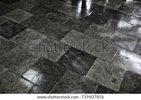 Floor with stone slabs.
